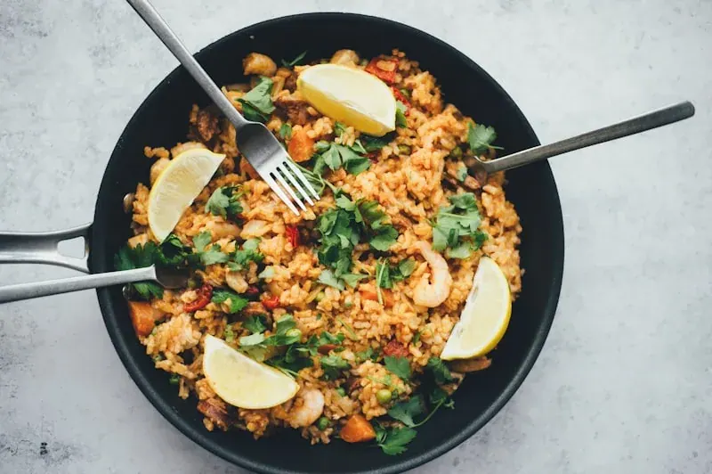 Savoury vegetable dalia in a black pan